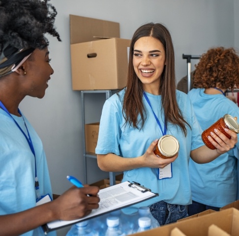 Dental team members volunteering at a food pantry