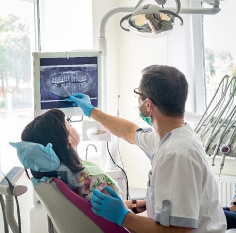 Jeffersonville dentist showing a patient an X-ray