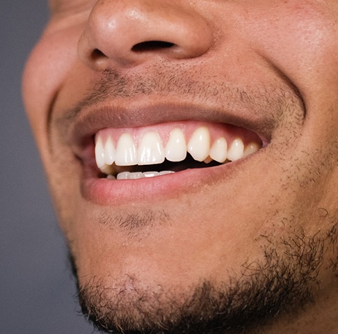 Closeup of smiling patient with dental bridge in Jeffersonville