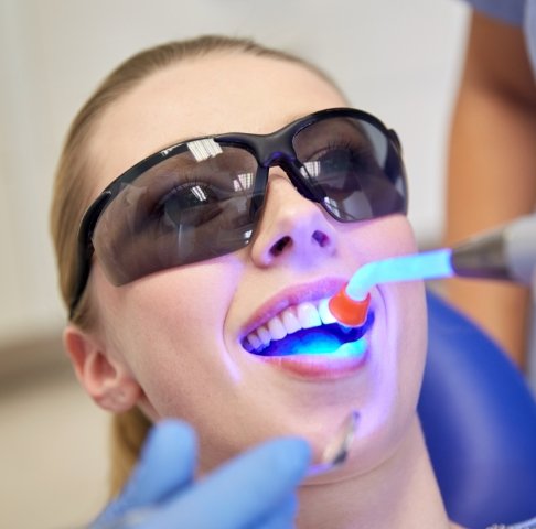 Patient receiving cosmetic dental bonding treatment