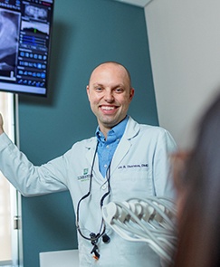Emergency dentist Dr. Thornton showing a patient X-rays