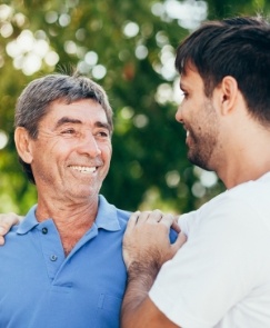 Man smiling after emergency dentistry for toothache