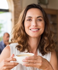 Woman sharing smile after repairing chipped and broken tooth