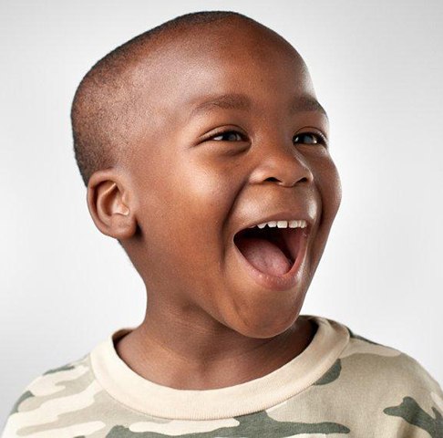 Young boy smiling after getting a fluoride treatment for children in Jeffersonville 