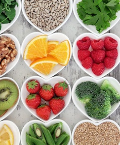 Spread of healthy foods for dental implants in heart-shaped bowls