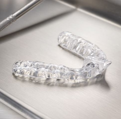 Clear nightguard for bruxism on metal tray