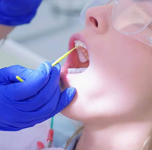 Patient receiving fluoride treatment