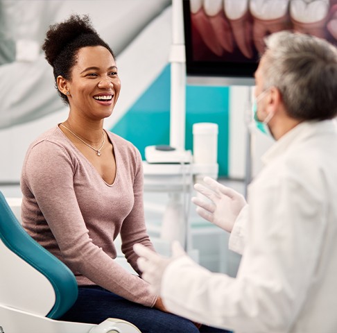 Dentist performing oral cancer screening