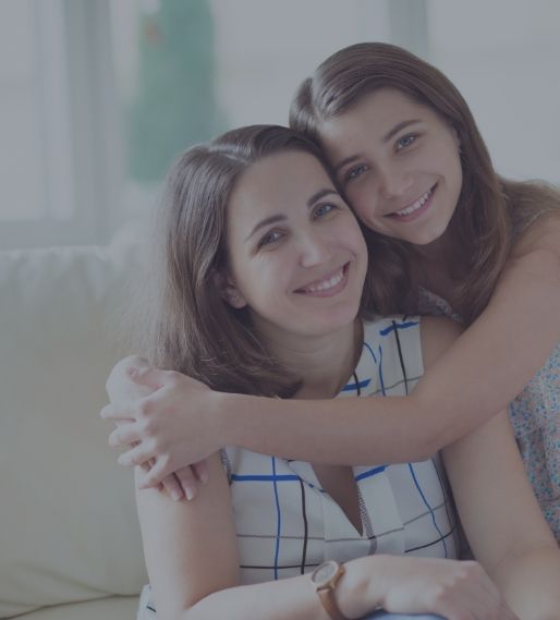 Smiling mother and daughter after children's dentistry visit