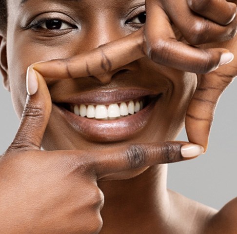 Closeup of smiling woman after using professional take-home teeth whitening kit in Jeffersonville